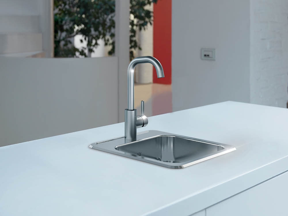 Kindred drop in stainless steel prep sink in a white kitchen island
