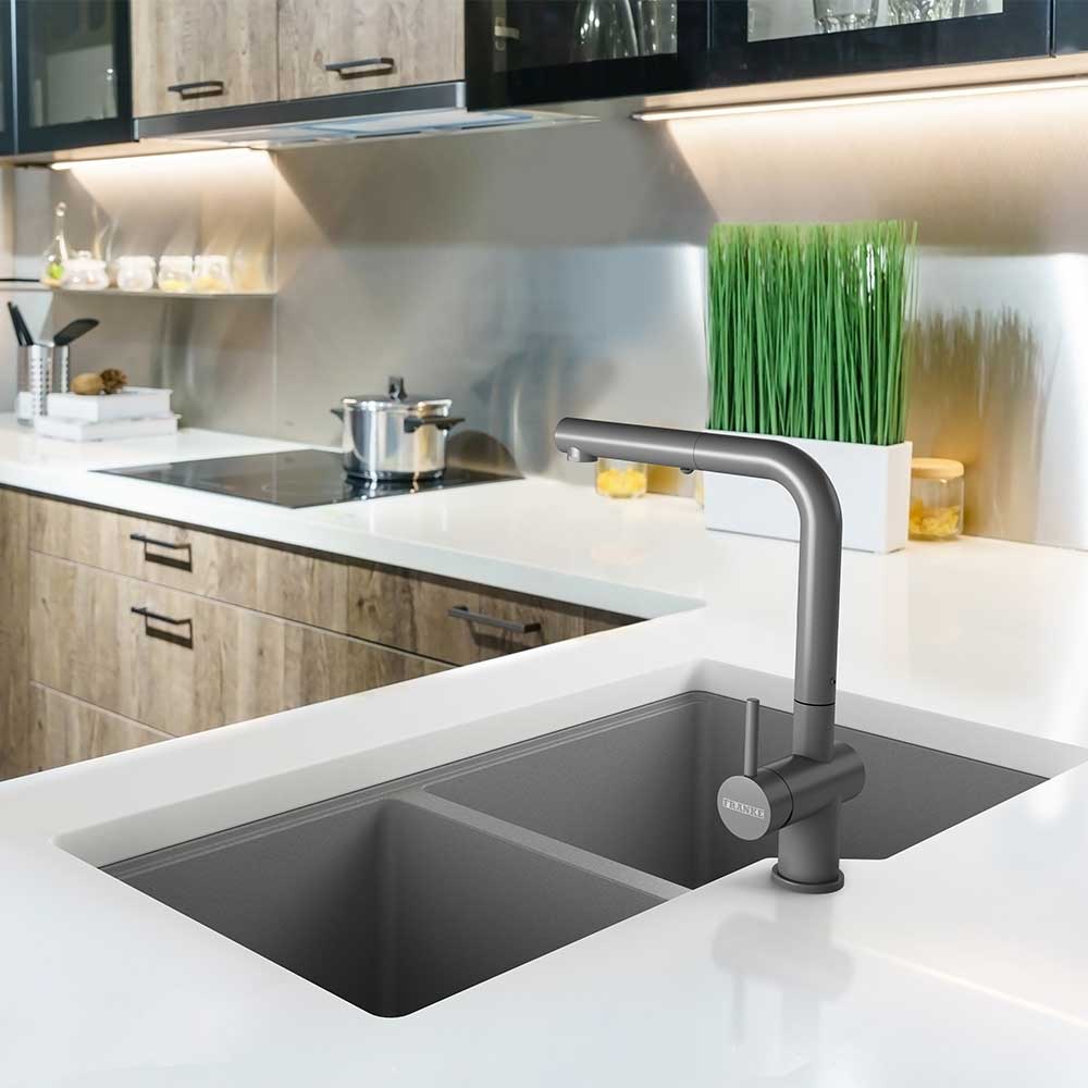 Stainless kitchen sink and Tap water in the kitchen. The interior of the kitchen room of the apartment. Built-In Appliances. Kitchen Appliance. Domestic Appliances test