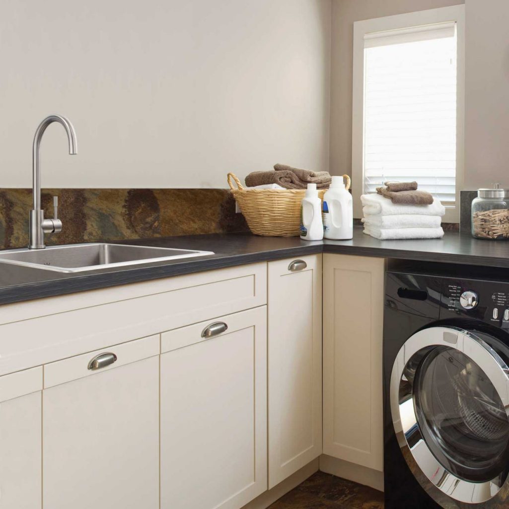 42-22341596 Kindred single bowl stainless steel deep capacity sink in a beige laundry room