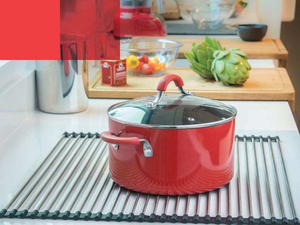 large pot resting on a kindred sink roller mat